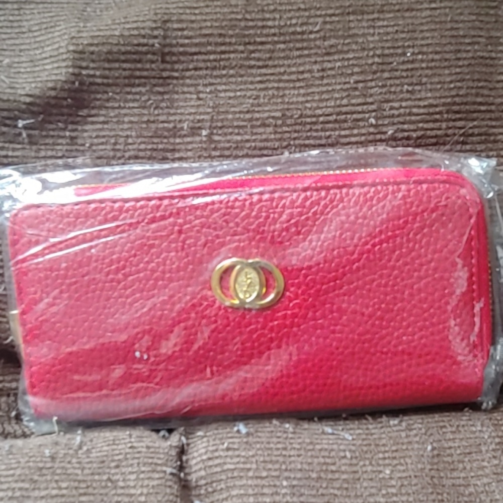 Brand new LYD red wallet in a plastic wrapping